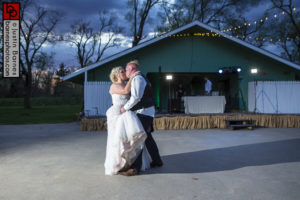 Bow Ty Audio DJs in Bellevue, NE while the bride and groom share a kiss